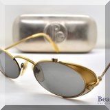 H83. Set of vintage gold rimmed Jean Paul Gaultier sunglasses with case. - $195 
